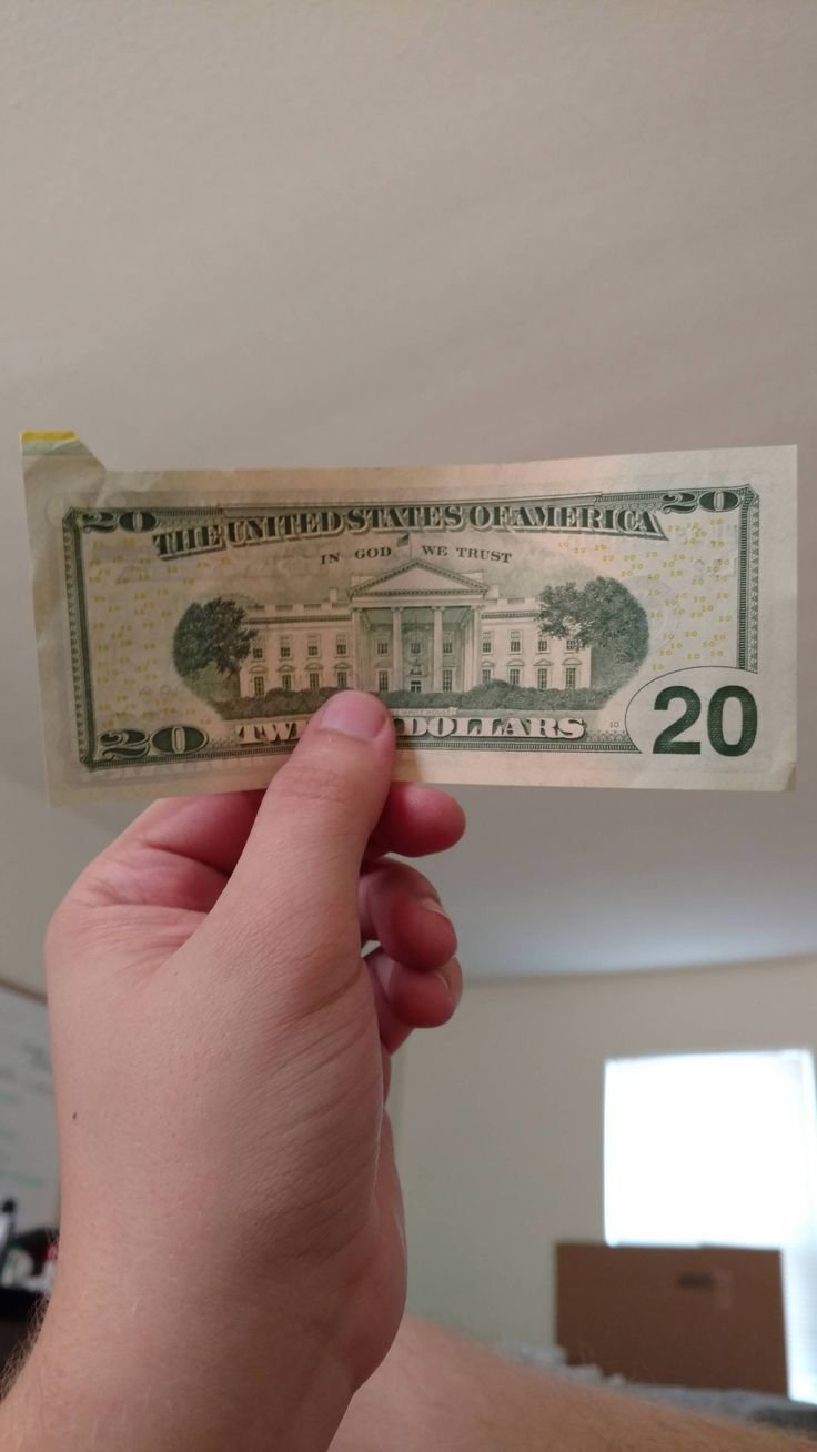 This twenty dollar bill my mom has_ Is it fake or is it an error_ This twenty dollar bill my mom has_ Is it fake or is it an error_
